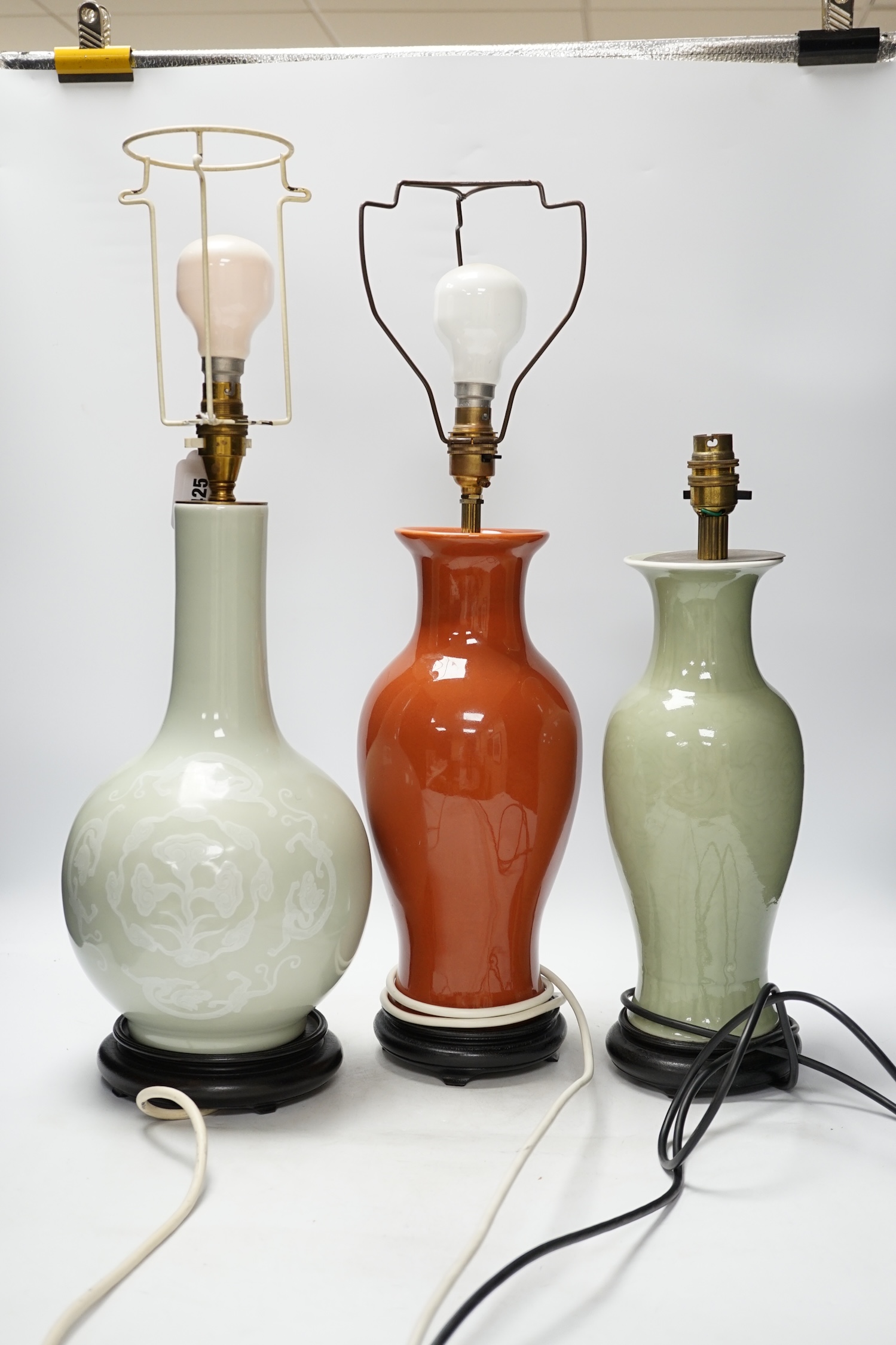 Three Chinese monochrome porcelain lamp bases, 20th century, tallest 38cm high